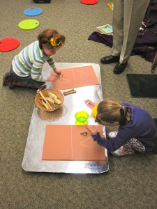 Young paleontologists Amelia and Mariah discover and chart.